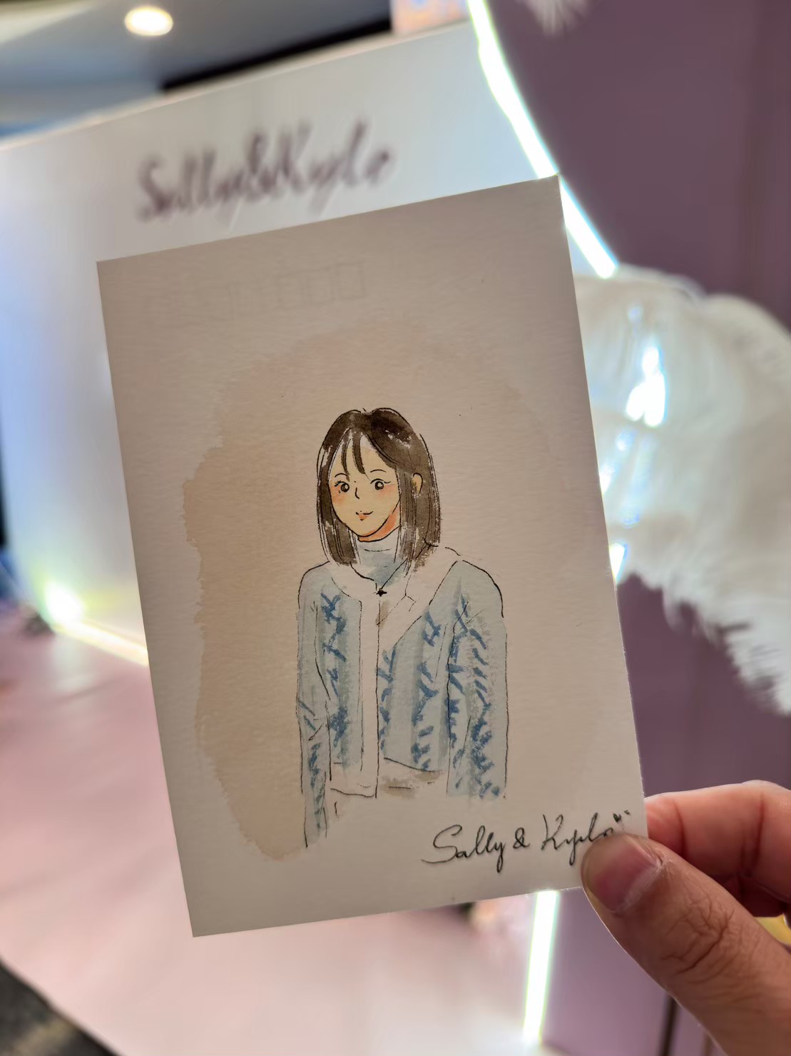 賓客手持婚禮現場完成的水彩肖像